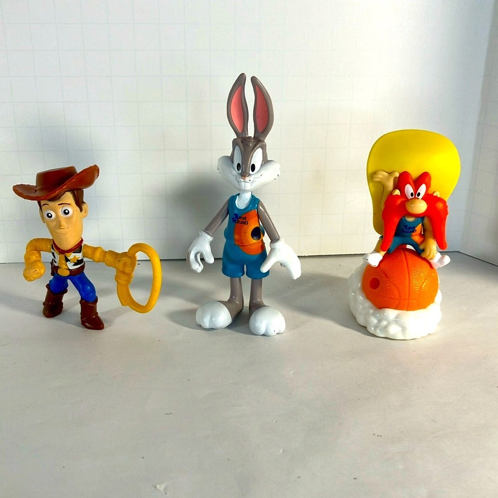 Cartoon character figurines. Woody, Bugs Bunny, Yosemite Sam
